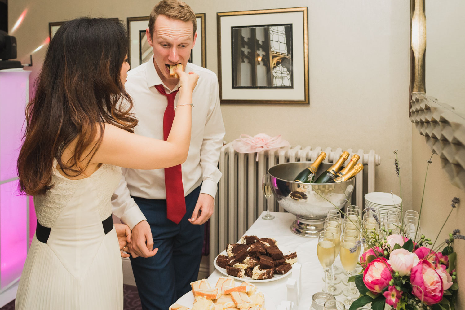 funny eating cake at wedding, Carine Bea Photography