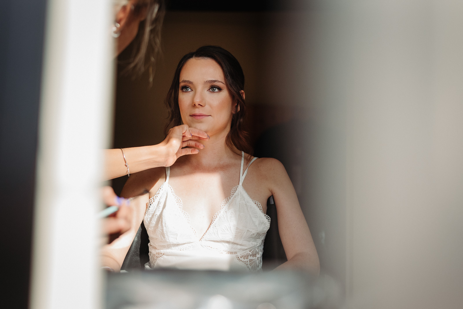 stunning bride getting ready for wedding in countryside