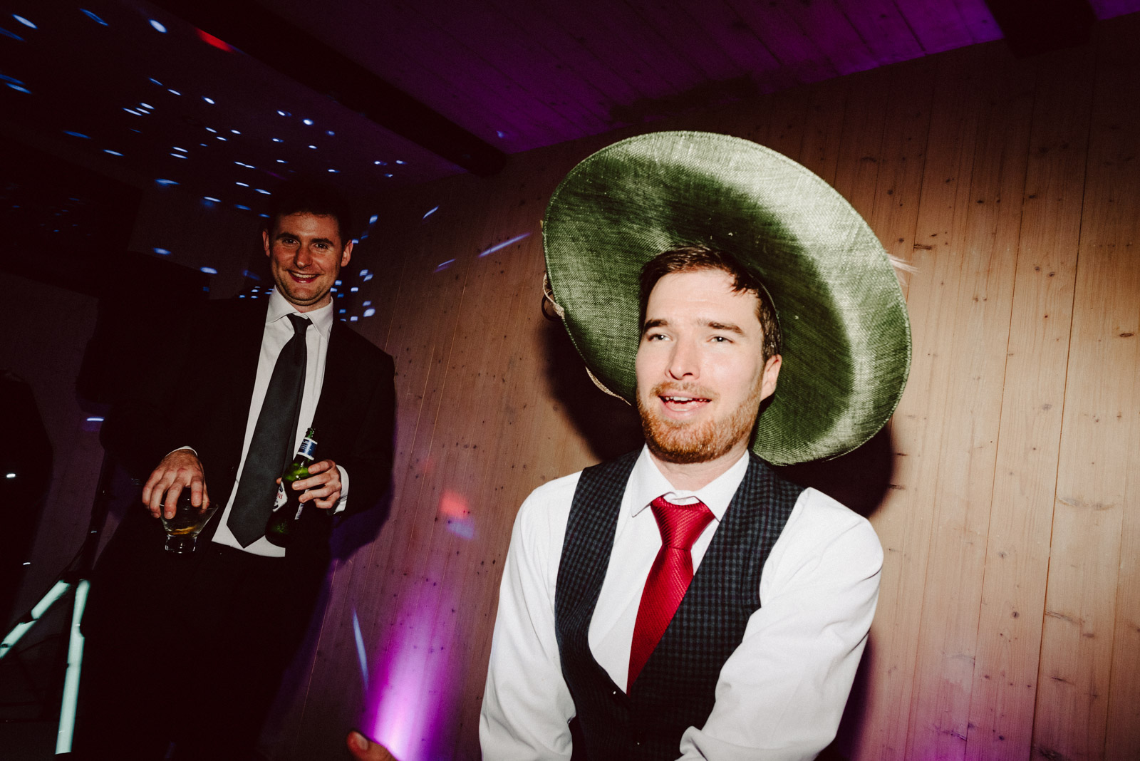 best man using a lady hat in wedding in Nether Winchendon House